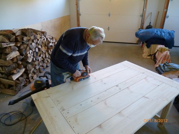 Dad Uses Tack Cloths After Sanding to Ensure a Smooth Finish 