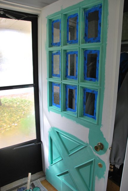 A painted turquoise front door on a red brick bungalow. A perfect DIY project to amp up your curb appeal! - via the sweetest digs