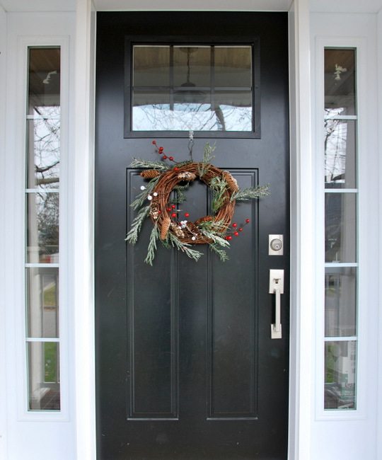 Want to make a winter wreath for your front door? Here is the easiest DIY rustic Christmas wreath EVER. Uses a grapevine base and features pinecones, berries, and flocked greenery. So pretty! Head on over to the blog for the full how-to tutorial!