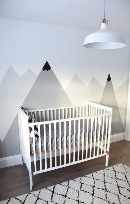 Looking for an amazing kids room or nursery decor idea? DIY this painted mountain range mural - easy and budget friendly! Perfect for a graphic, black and white, camping, adventure style room. Head on over to the blog for the full how-to tutorial.