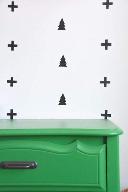 Looking for nursery or kids room decor ideas? Check out this black, white, and green boys room with a scandi meets camp design. Using swiss cross and tree wall decals, a painted dresser, and more! Click through for the how-to tutorial on the blog.