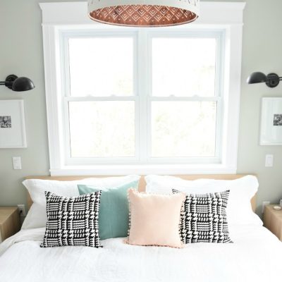 A budget-friendly Master Bedroom Makeover. Get this neutral, eclectic, modern bedroom design with the source list and DIY project ideas in the post. Great bedroom decor ideas and tips!