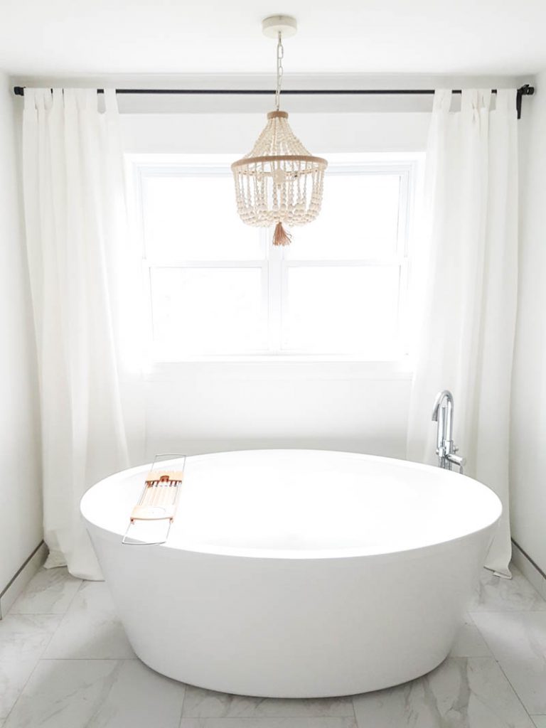 freestanding tub with chandelier