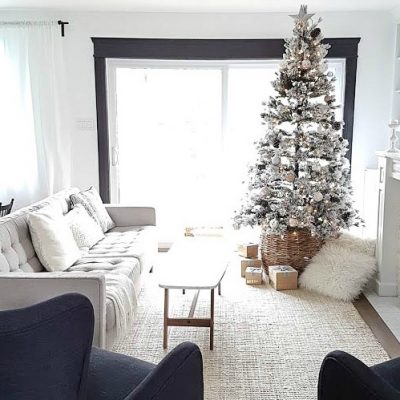 Decorate for the holidays with a #flocked #christmas #tree. Adorned with mixed metal ornaments in rose gold and silver, with neutral accents. Cozy, pretty, and classic decor!