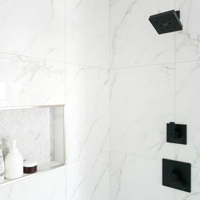 A #marble #shower featuring #matte #black #faucet. Get this #modern #spa #bathroom look for less!