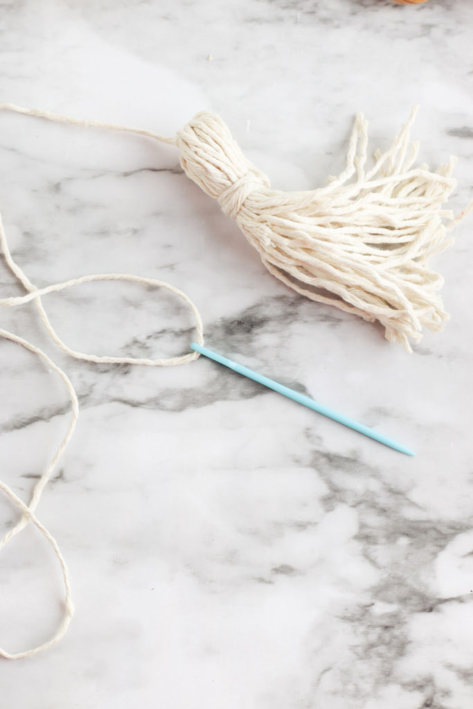 Easy DIY: Make A Wood Bead Garland with Tassels - THE SWEETEST DIGS