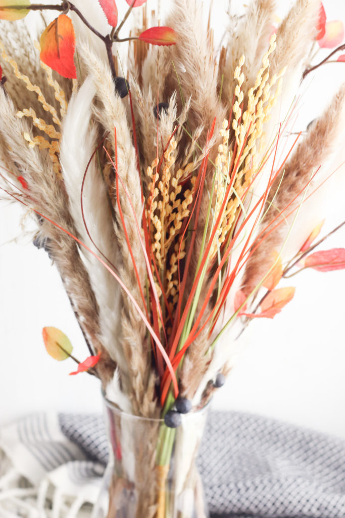 Pampas arrangement with fall stems, berries and leaves.