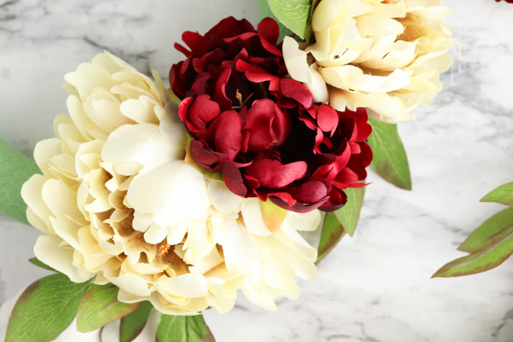 White and red peony faux flowers.