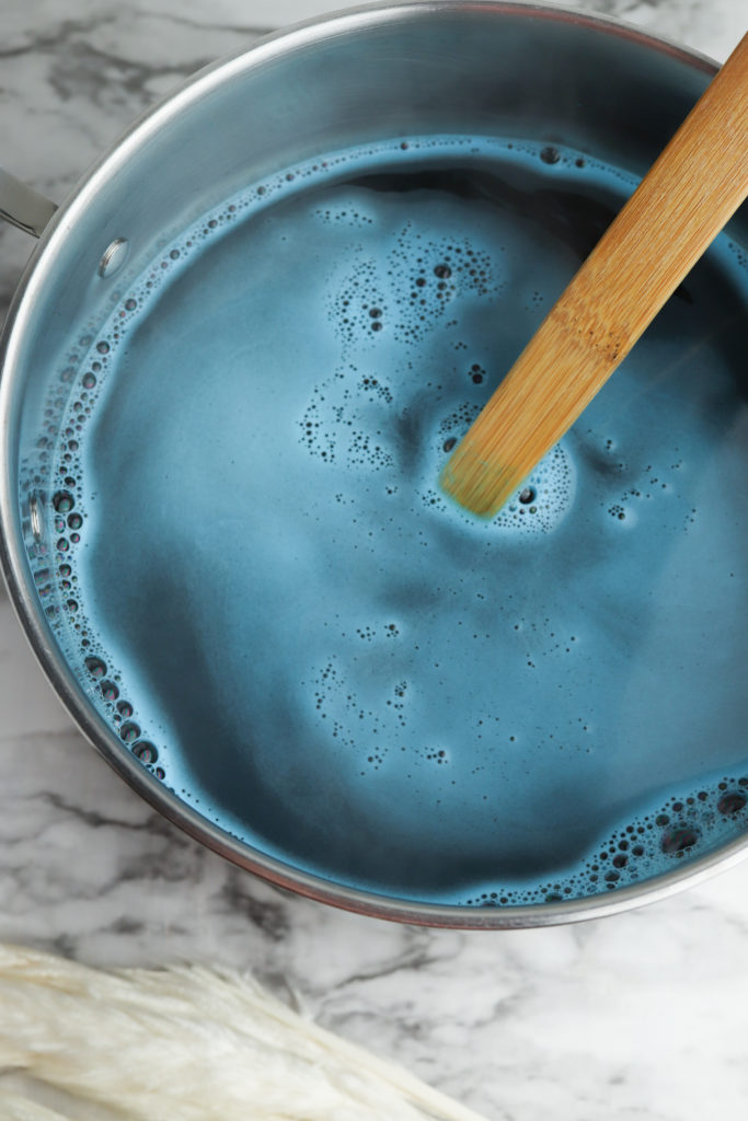 Blue fabric dye mixed with boiling water.